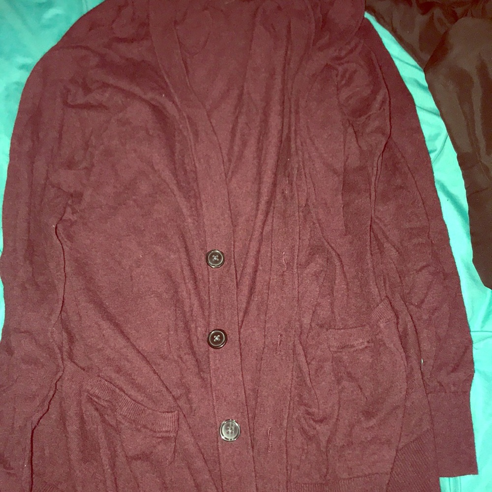 This is a burgundy cardigan